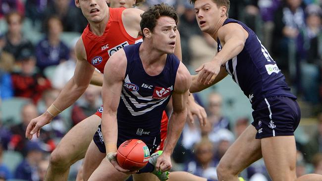 Lachie Neale looks to dish out a handball. Picture: Daniel Wilkins