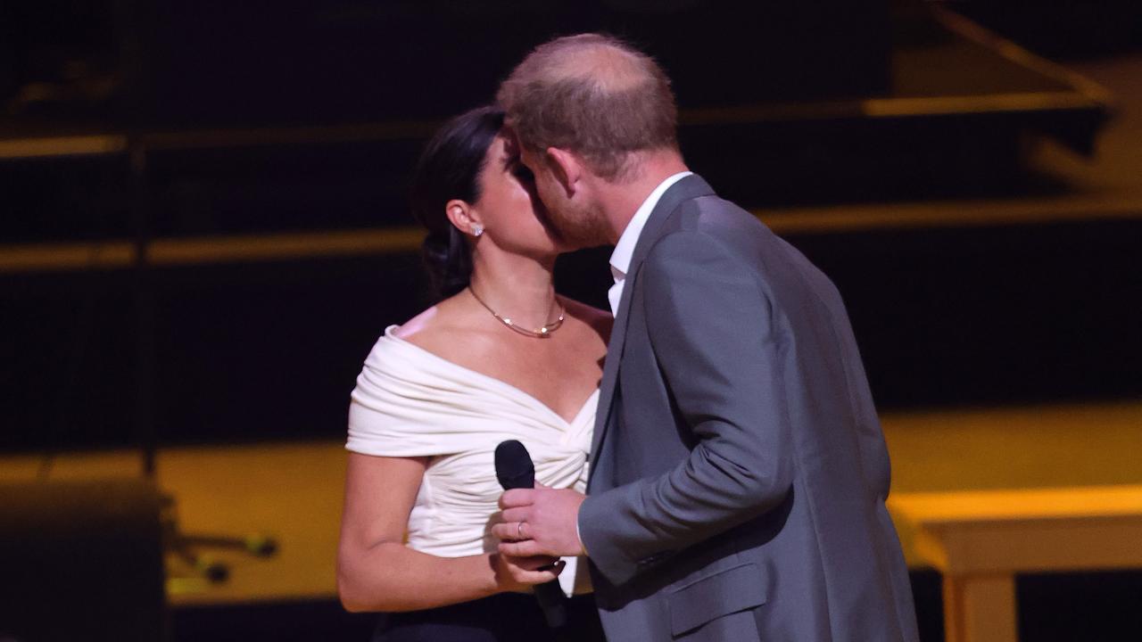 The pair kiss on-stage at the Invictus Games. Picture: Chris Jackson/Getty Images for the Invictus Games Foundation