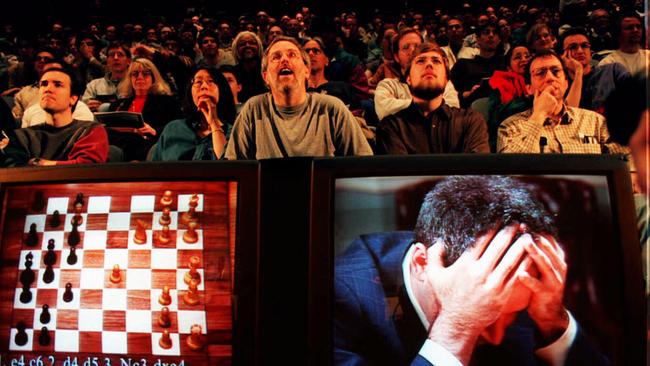 TV monitors show world chess champion Garry Kasparov with his head in his hands after a defeat by IBM supercomputer Deep Blue in 1997.