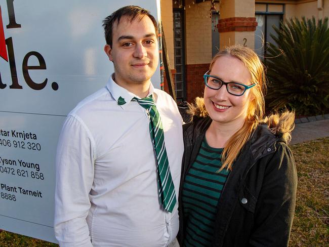 Ryan McCan, 24, and his partner Rhian Hill, 25, at their first home, which they've recently bought in Hoppers Crossing. They've been living with parents in Tarneit but will soon move into the house. It's for a "First-Home Buyers' Guide" set to run in the Sunday Herald Sun. Picture: Mark Stewart