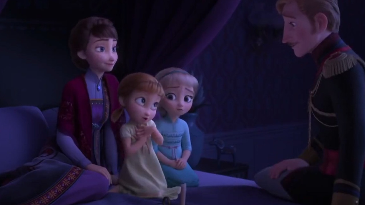 The trailer opens with Elsa and Anna as children being told a bedtime story by their father.