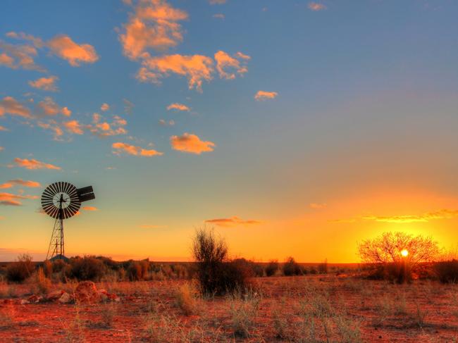 Lonely windmill in the evening time somewhere in remote Australia.