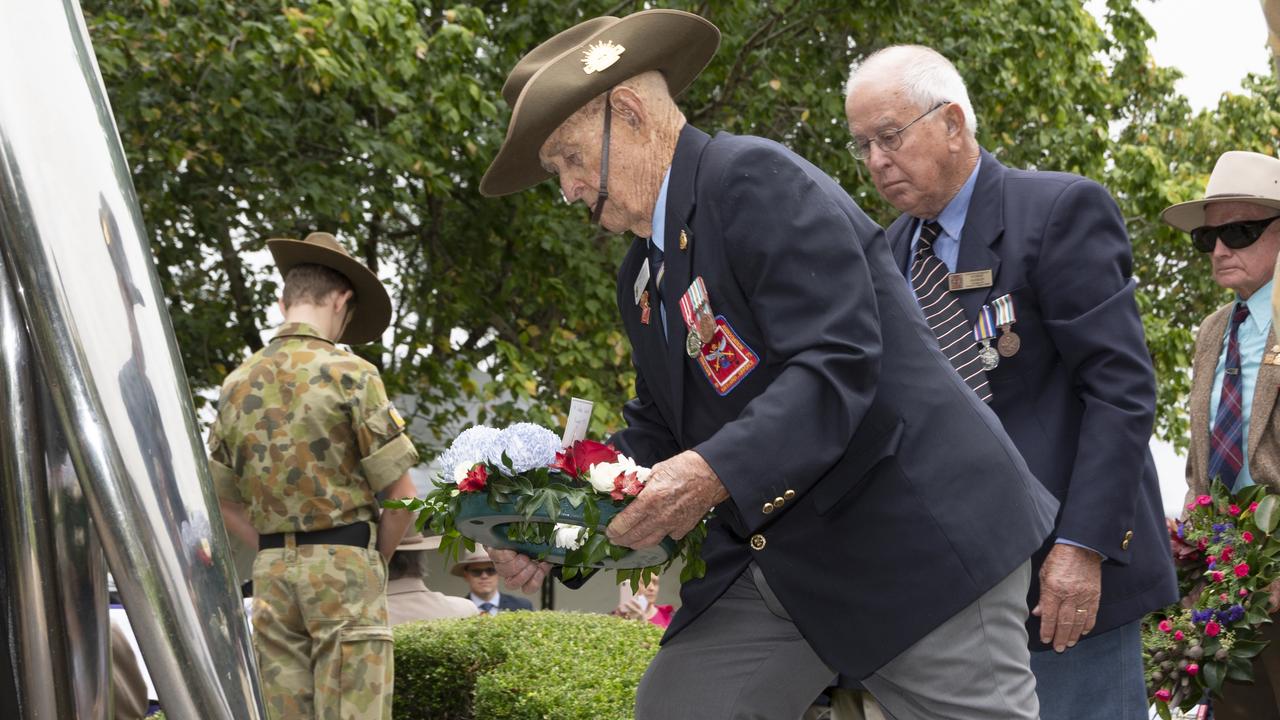 Member of the first intake of National Servicemen in 1951, Murray Handley lays a wreath at the National Service 70th Anniversary memorial at the ceremony in East Creek Park, Toowoomba.