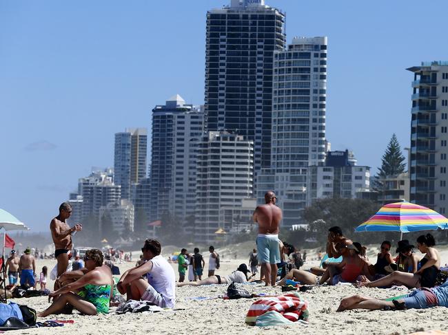 People njoying the sun and water at Surfers Paradise Beach on a hot Boxing Day. Picture: Jerad Williams