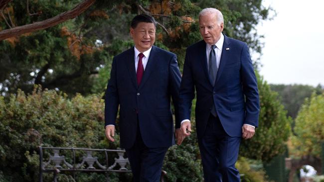 Chinese President Xi Jinping and US President Joe Biden walk together after a meeting during the APEC Leaders' week in Woodside, California. Picture: AFP