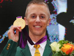 MELBOURNE, AUSTRALIA - JUNE 17: Australian athelete Jared Tallent receives his Olympic gold medal at the Old Treasury Building on June 17, 2016 in Melbourne, Australia. Tallent today received his gold medal for the 50km Walk at the London 2012 Olympic Games after Russian race winner Sergey Kirdyapkin was stripped of the medal for testing positive to banned substances. (Photo by Michael Dodge/Getty Images)