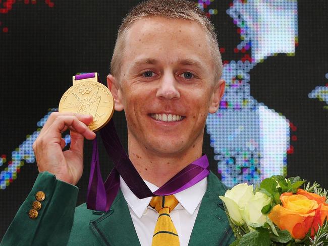 MELBOURNE, AUSTRALIA - JUNE 17: Australian athelete Jared Tallent receives his Olympic gold medal at the Old Treasury Building on June 17, 2016 in Melbourne, Australia. Tallent today received his gold medal for the 50km Walk at the London 2012 Olympic Games after Russian race winner Sergey Kirdyapkin was stripped of the medal for testing positive to banned substances. (Photo by Michael Dodge/Getty Images)