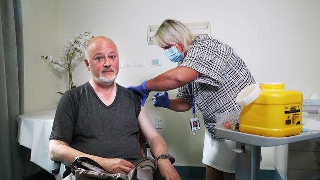 Director of Public Health Doctor Mark Veitch with clinical nurse consultant Nikki Lane at the Roy Fagan Centre in Hobart. First Tasmanians to be given the AstraZeneca vaccination against COVID-19. Picture: Nikki Davis-Jones