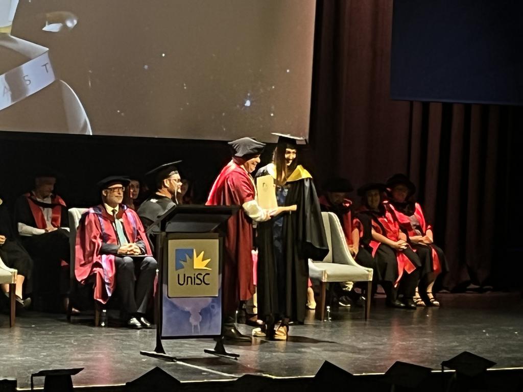 Graduates from the University of the Sunshine Coast's Fraser Coast campus celebrating at the Brolga Theatre.