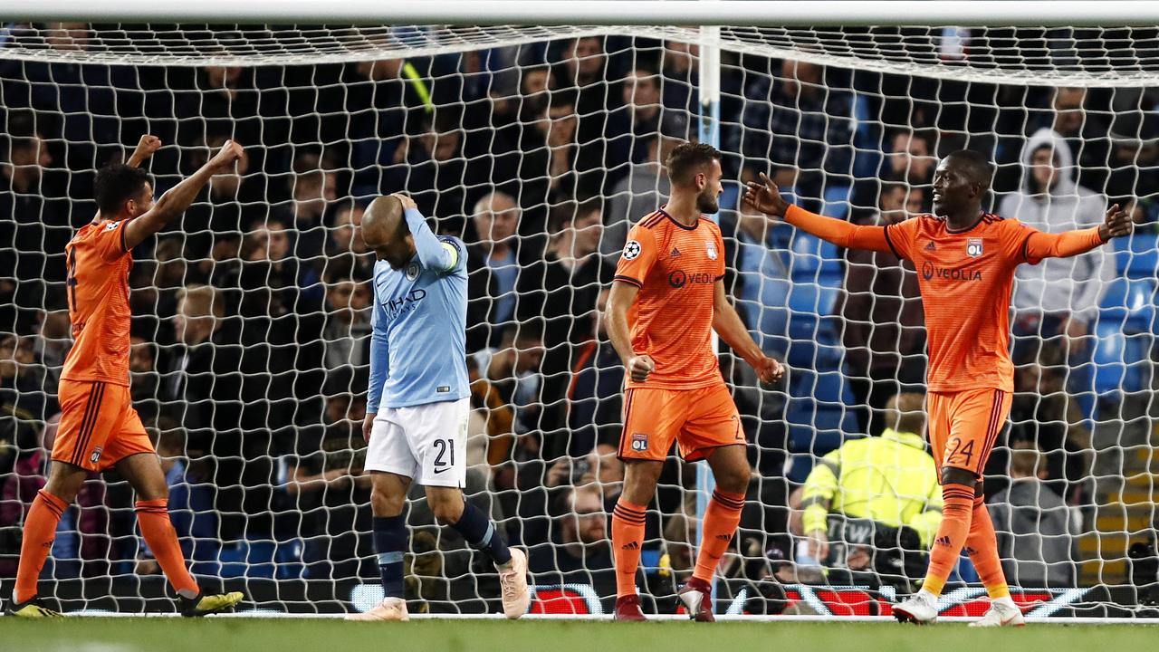 David Silva of Manchester City looks dejected as Pape Cheikh Diop of Lyon celebrates the final whistle. Picture: Getty Images