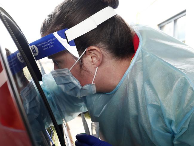 BALLARAT, AUSTRALIA - AUGUST 21: Medical professionals perform COVID testing at a drive through clinic in Ballarat on August 21, 2020 in Ballarat, Australia. COVID-19 testing in Ballarat has increased as health authorities work to avoid the spread of coronavirus in regional Victoria. Metropolitan Melbourne is under stage 4 lockdown restrictions, with people only allowed to leave home to give or receive care, shopping for food and essential items, daily exercise and work while an overnight curfew from 8pm to 5am is also in place. The majority of retail businesses are also closed. Other Victorian regions are in stage 3 lockdown. The restrictions, which came into effect from 2 August, have been introduced by the Victorian government as health authorities work to reduce community COVID-19 transmissions across the state. (Photo by Darrian Traynor/Getty Images) ***Bestpix***