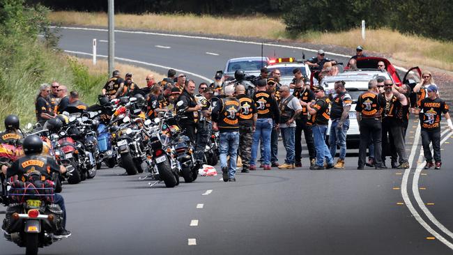 Police keep a watchful eye on the Bandidos motorcycle gang as they arrive in Burnie in Tasmania's North-West. Picture: CHRIS KIDD