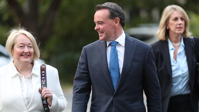 Michael O’Brien arrives at parliament flanked by supporters before a spill motion against him. Picture: David Crosling