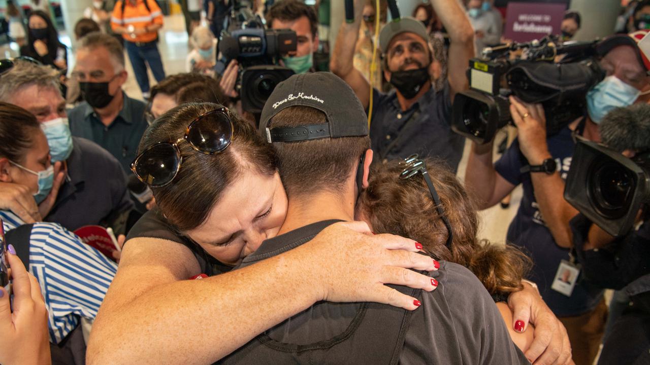 Nick Marriot was welcomed home by mum Kelli and sister Ruby, 11 as easing travel restrictions allowed more people back into Queensland. Picture: Brad Fleet