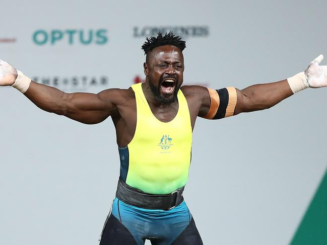 GOLD COAST, AUSTRALIA - APRIL 07:  Francois Etoundi of Australia celebrates a lift during the Men's 77kg Weightlifting Final on day three of the Gold Coast 2018 Commonwealth Games at Carrara Sports and Leisure Centre on April 7, 2018 on the Gold Coast, Australia.  (Photo by Mark Metcalfe/Getty Images)