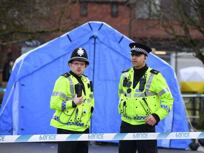 Police stand guard at the shopping centre where Sergei SkrIpal and his daughter Yulia were poisoned. Picture: Chris J Ratcliffe