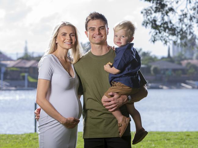 Supercars driver Tim Slade with partner Dani and 2-year-old Jordy.  Dani and Tim are expecting their second child in January. Tim will be racing in this year's  GC500 in Surfers Paradise .  Picture: Jerad Williams