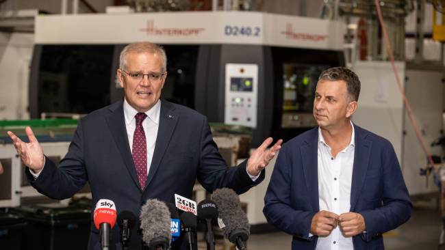 Prime Minister Scott Morrison and Liberal Candidate Andrew Constance toured a canning factory in the seat of Gilmore on Monday. Picture: Jason Edwards