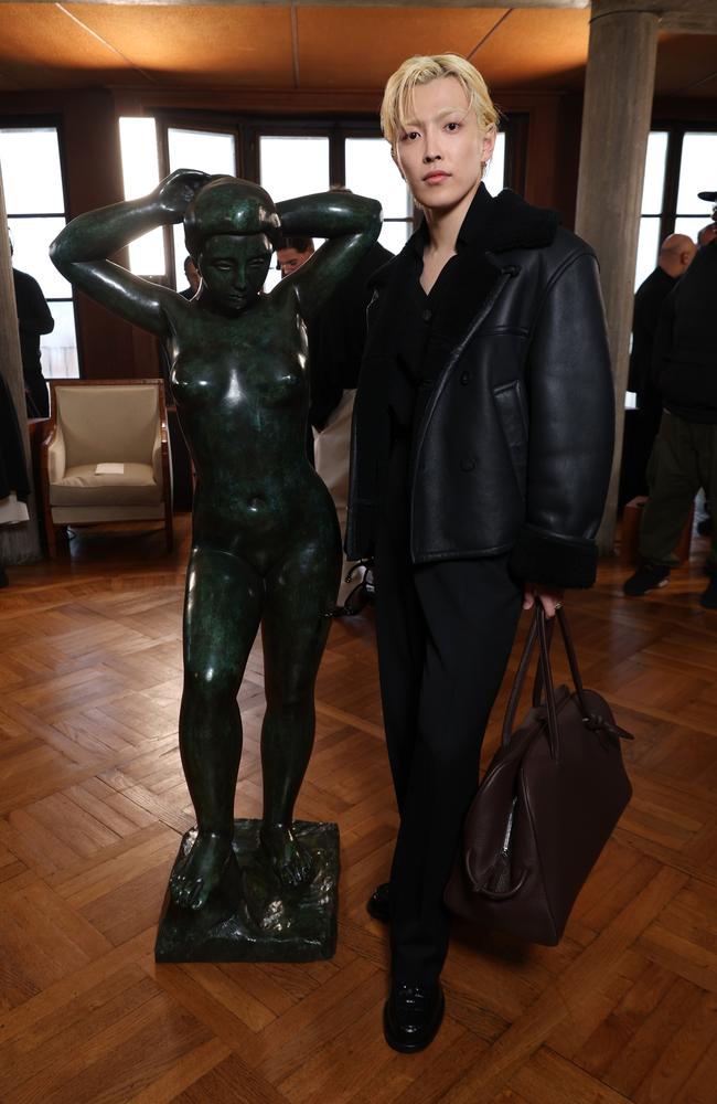 South Korean rapper and singer Hongjoong was also cornered for a picture next to the popular statue at the Jacquemus Menswear Fall-Winter 2025/2026 show. Picture: Pascal Le Segretain/Getty Images