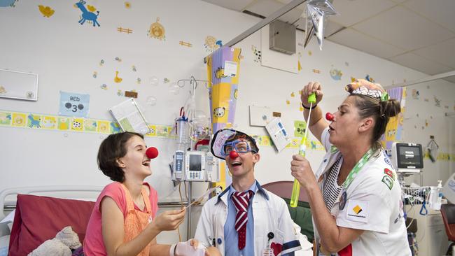 FUN AND GAMES: Toowoomba Hospital patient Eva Palmer joins in on the fun with Dr O'Dear (Robbie O'Brien) and Dr Sniggles (Helen Quinlan) as the Humour Foundation's clown doctors pay the ward a visit. Picture: Kevin Farmer