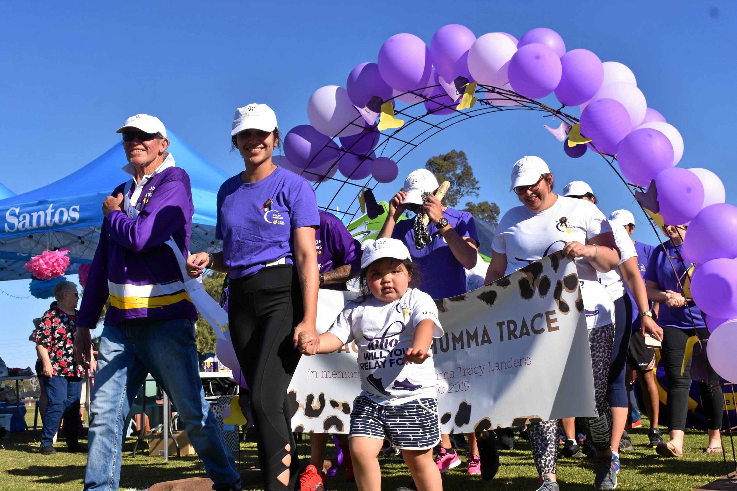 Bryan Vickery and Kaitlyn Landers lead the survivors and carers lap. Picture: Ellen Ransley