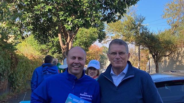 Treasurer and Kooyong MP Josh Frydenberg hands out how to vote cards at a polling booth in Hawthorn alongside former Victorian Premier Ted Baillieu. Picture: Hugo Timms