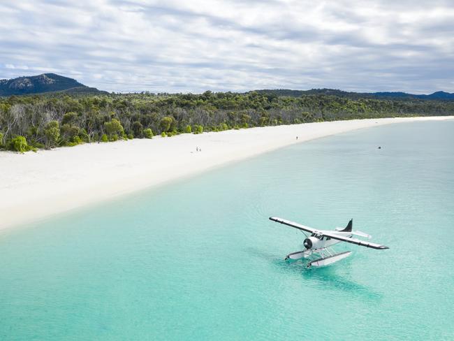 Aerial of seaplane next to the beach Whitehaven Beach Whitsunday Islandcredit Brooke Miles for Riptide Creativeescape december 6 2020 destination whitsundays