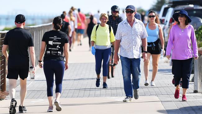 Large numbers of people on the boardwalk on the Esplanade at Henley Beach on Good Friday morning. Picture: AAP/Mark Brake