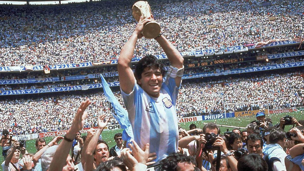 Maradona holding aloft the World Cup after winning the final. Picture: Carlo Fumagalli/AP