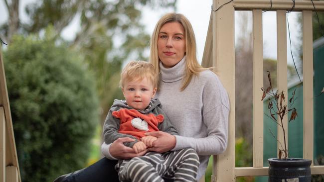 Domenique Szantyr, 35 and son Lachlan, 2. Domenique is trying to get to South Australia to her terminally Ill mother. Picture: Jason Edwards