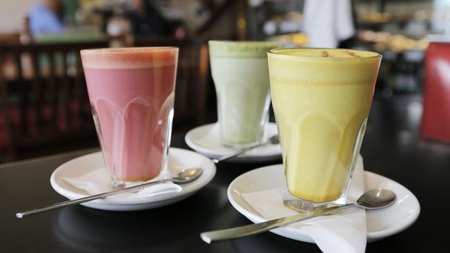 Three of the rainbow lattes available at Macquarie Food Store. Picture: MATHEW FARRELL