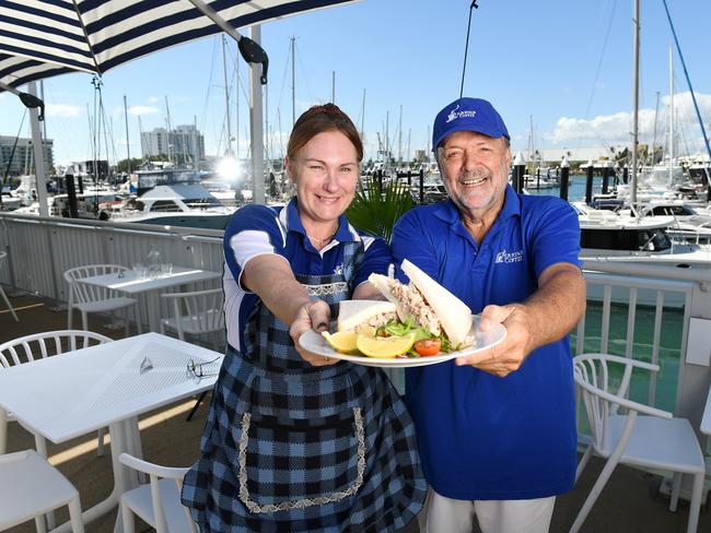 Marina Coffee manager Brydy Stanfield and owner Ron Barker with the cafe½ specialty, The Crab Sandwich. Picture: Shae Beplate.