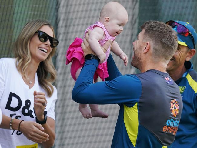 David Warner, right, with Candice (left) and Isla an Australian cricket team training session at the MCG. Picture: AAP Image/Michael Dodge