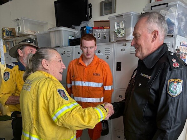 NSW Police deputy commissioner Peter Thurtell meets volunteers at the Taree flood recovery centre on Thursday. Supplied