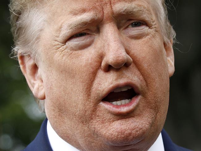 President Donald Trump speaks to members of the media on the South Lawn of the White House in Washington, Tuesday, May 5, 2020, before boarding Marine One for a short trip to Andrews Air Force Base, Md., and then on to Phoenix, Ariz. (AP Photo/Patrick Semansky)