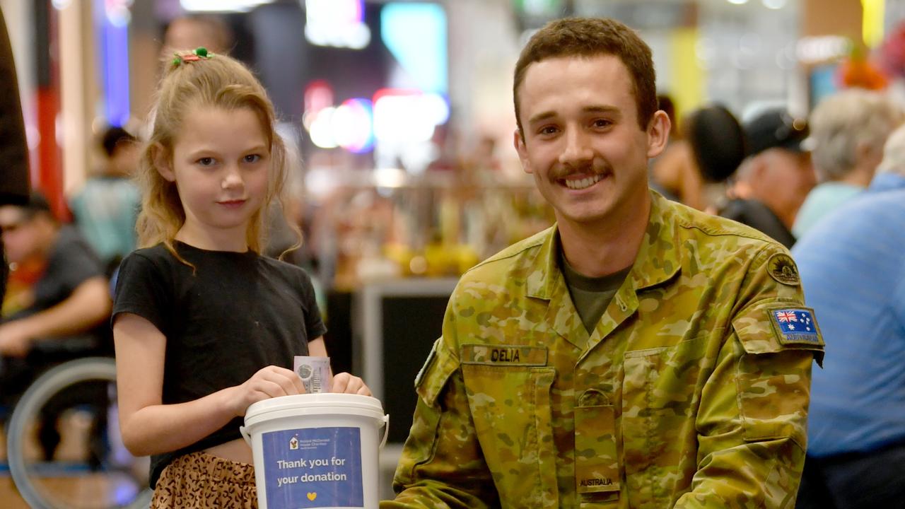 Indie Lowe, 9, with Private Daniel from 1RAR at Willows Shopping Centre. Picture: Evan Morgan