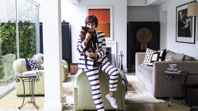 Suzy Crittenden with her cat Stella in the lounge room of her home in South Yarra. Picture: Aaron Francis