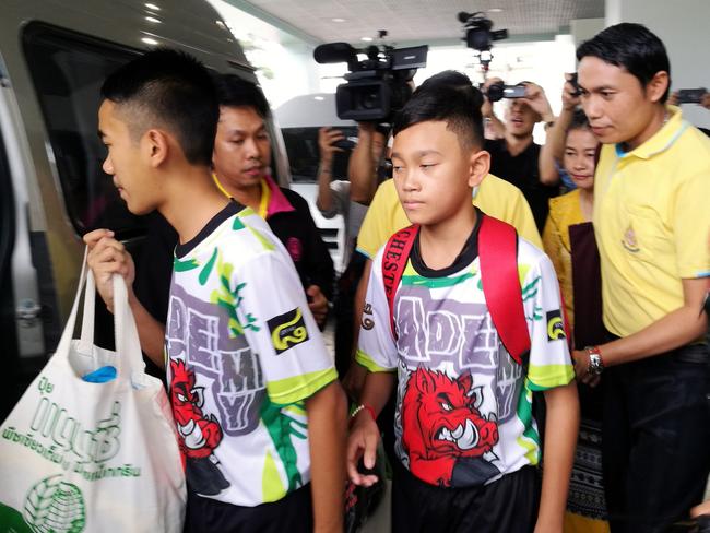 Some of the rescued twelve members of the Wild Boar soccer team depart from the Chiangrai Prachanukroh Hospital.