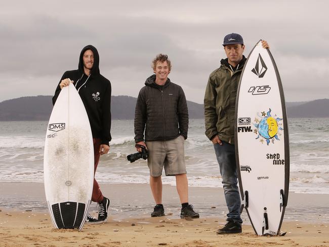 Mikey Brennan, left, and Marti Paradisis, right, are among a small crew of Tasmanians pioneering big waves. Photographer Andrew Chisholm (centre) has helped record and share their exploits. Picture: Mathew Farrell