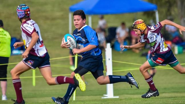 Brigham Siteine runs the ball for Helensvale.