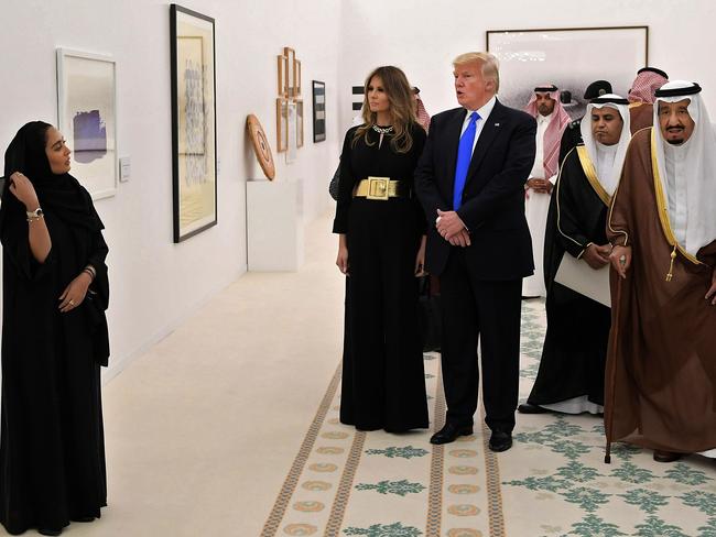 Saudi Arabia's King Salman bin Abdulaziz al-Saud (R), US President Donald Trump (2nd L) and US First Lady Melania Trump look at a display of Saudi modern art at the Saudi Royal Court in Riyadh on May 20, 2017. Picture: Mandel Ngan