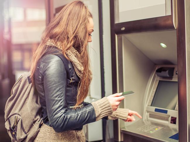 Generic pictore of a woman withdrawing money from credit card at ATM.  Picture: iStock