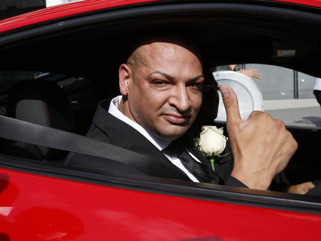 Groom Andrew Constantinou arrives at his wedding in a luxury Ferrari. Picture: David Swift