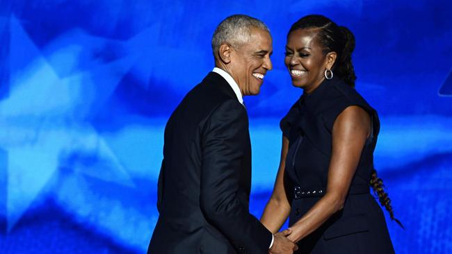 Barack Obama arrives onstage after Michelle Obama spoke to the convention. Picture: AFP.