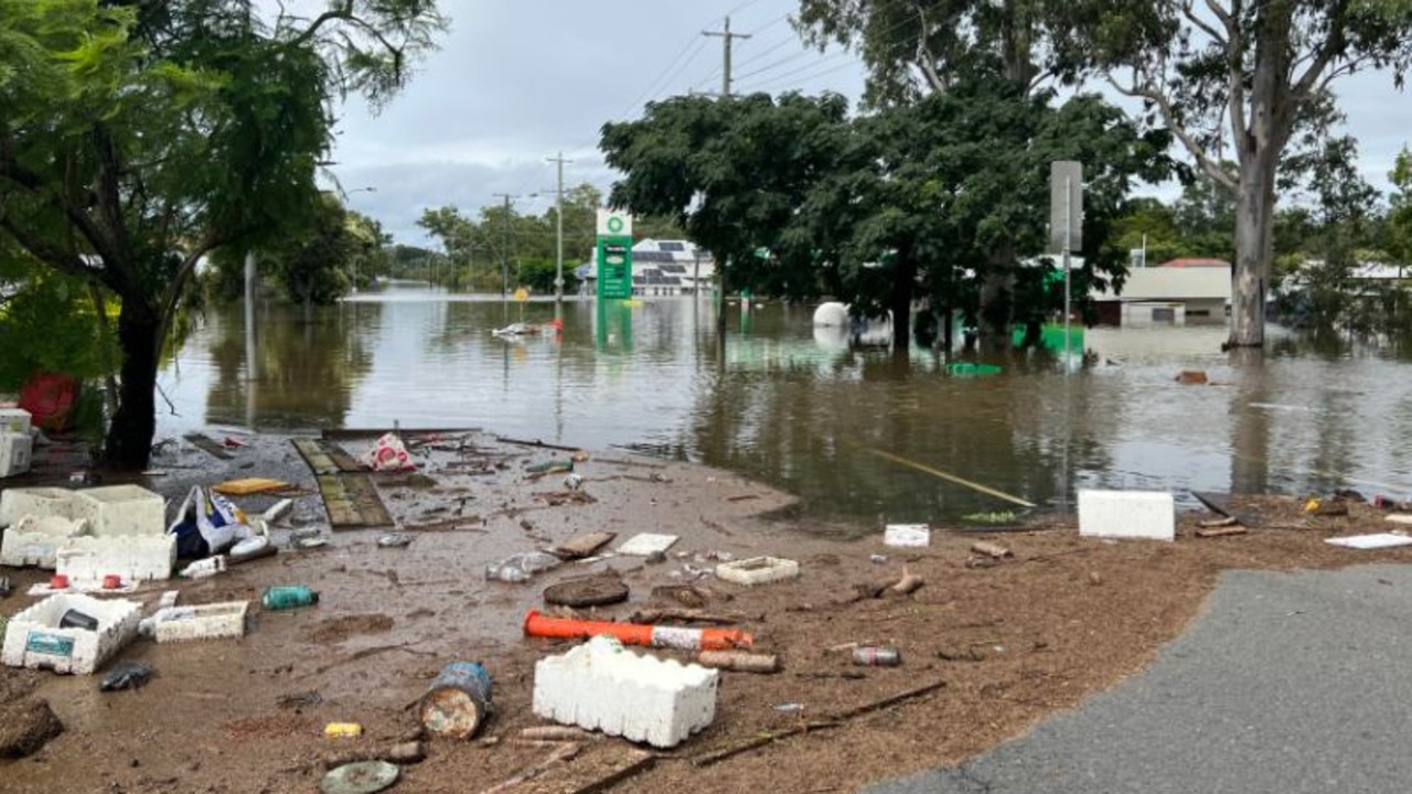 Mess left behind as water remains on Oxley Rd, in Brisbane's south-west. Picture: Vanessa Marsh