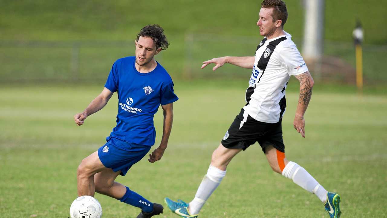 CLOSE BATTLE: Rockville's Braiden Hinch rounds Willowburn's Trent Donovan during their match at the weekend. Picture: Nev Madsen