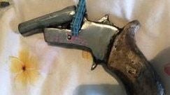 One of the pistols allegedly uncovered at the Carina Heights residence of Macey Collins, 23. Picture: QPS