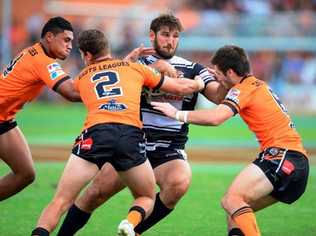 Seagulls stand-in Dave Taylor shows the Easts Tigers that taking him down is no easy feat. Picture: Steve Bell/SMP Images