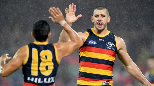 Eddie Betts high-fives Walker after a goal this season. Picture: Sam Wundke (AAP).