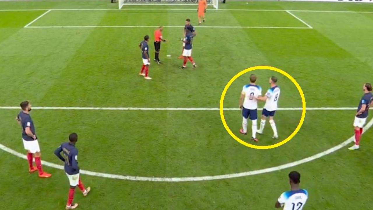 Harry Kane is supported by a teammate.